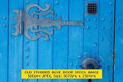Ornate Old Blue Door with Wrought Iron Decorations Product Image 1