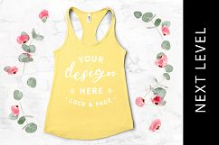Banana Cream Next Level 1533 Tank Top Racerback Flat Lay Product Image 1