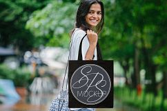 Woman holding Black Tote Bag Mockup Bundle Product Image 2