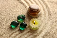 candle light and stones on sand Product Image 1