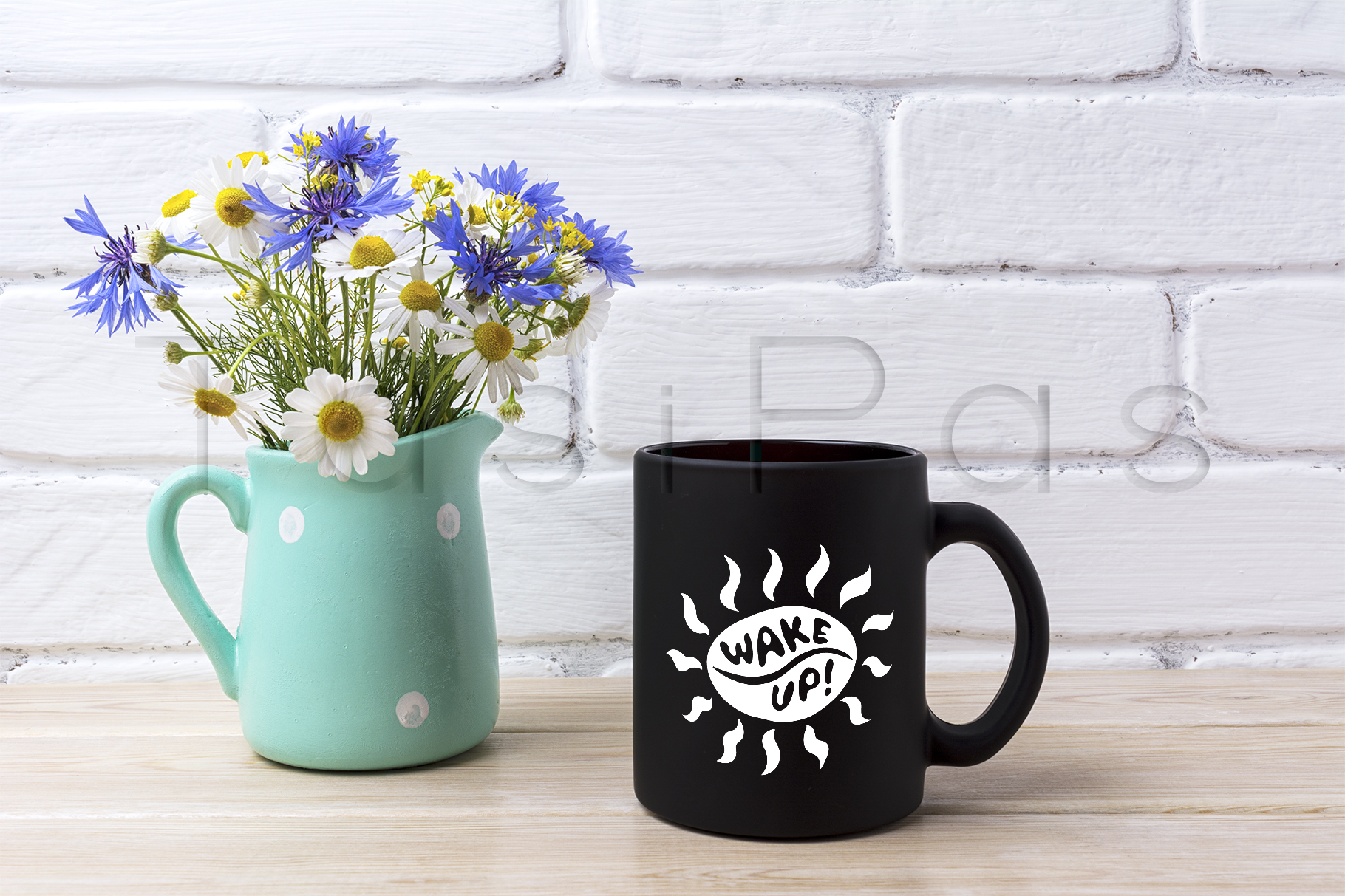 Download Black coffee mug mockup with cornflower and daisy in pitcher