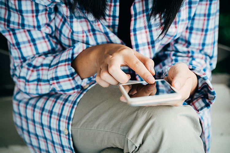 Woman using smartphone or mobile phone 
