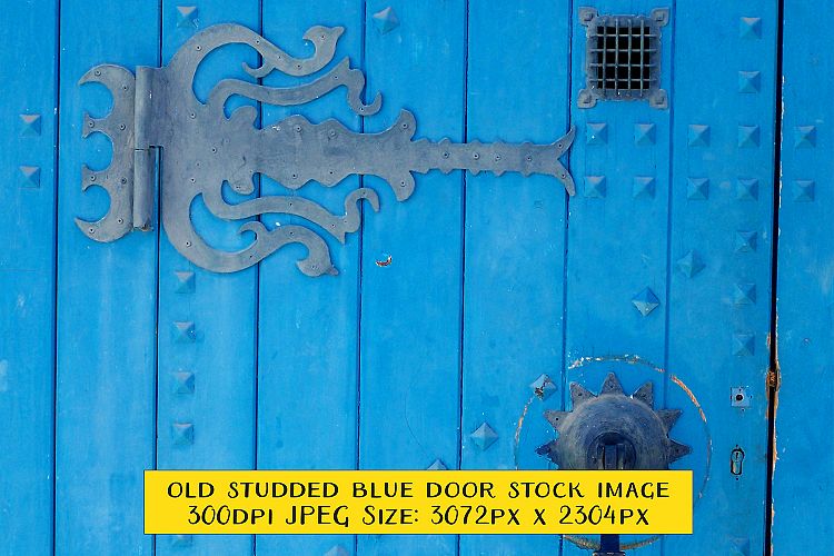 Ornate Old Blue Door with Wrought Iron Decorations