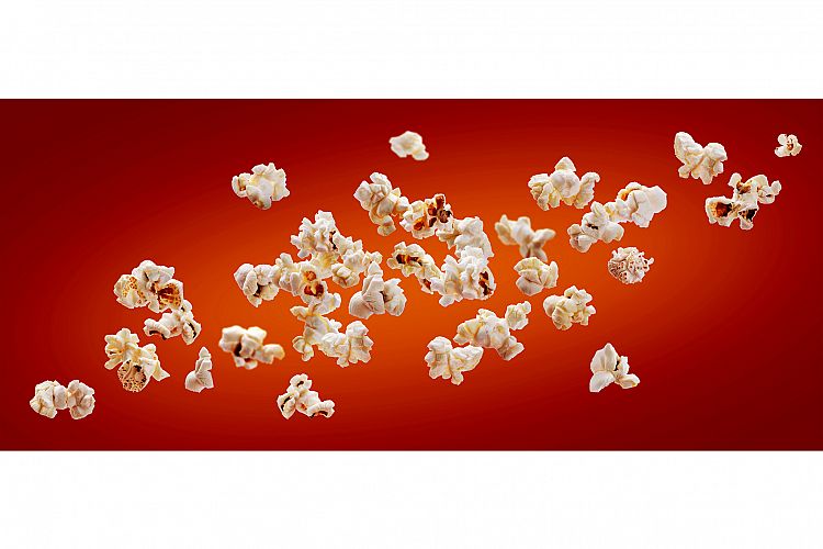 Popcorn isolated on red background