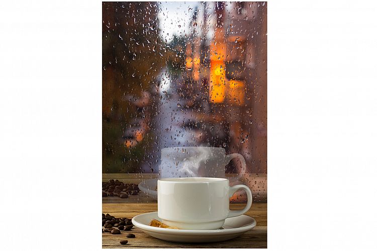 Cup of strong coffee on the rainy window background