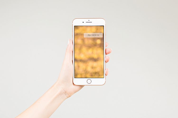 Female holding smartphone with blank screen 