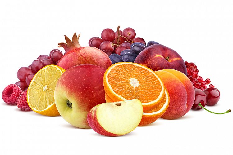 Heap of red fruits and berries isolated on white background