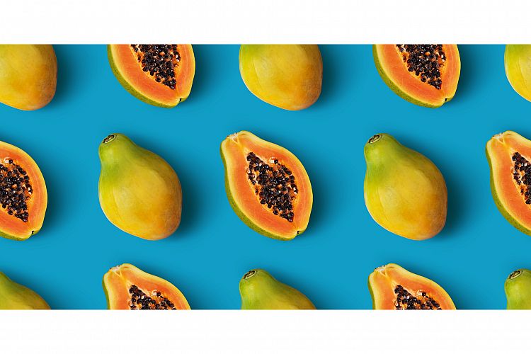 Papaya fruit seamless pattern on blue background