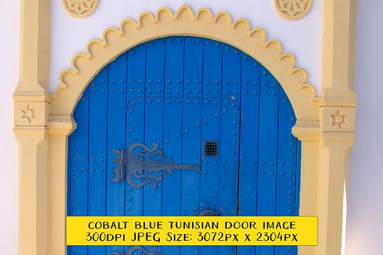 Ornate Archway and Blue Door Tunisia Street Scene