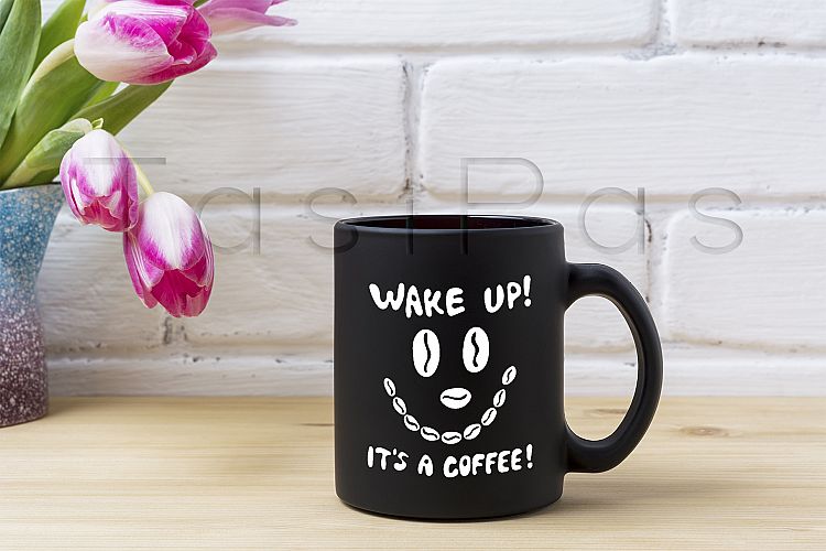 Black coffee mug mockup with magenta tulip