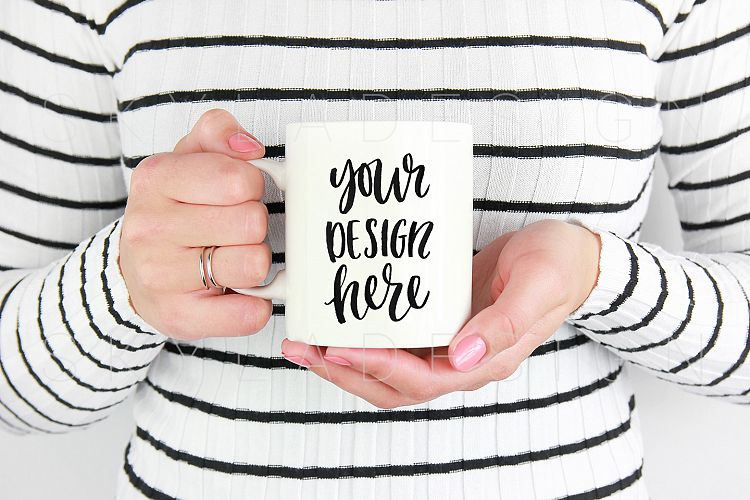 Woman holding white coffee mug mockup image