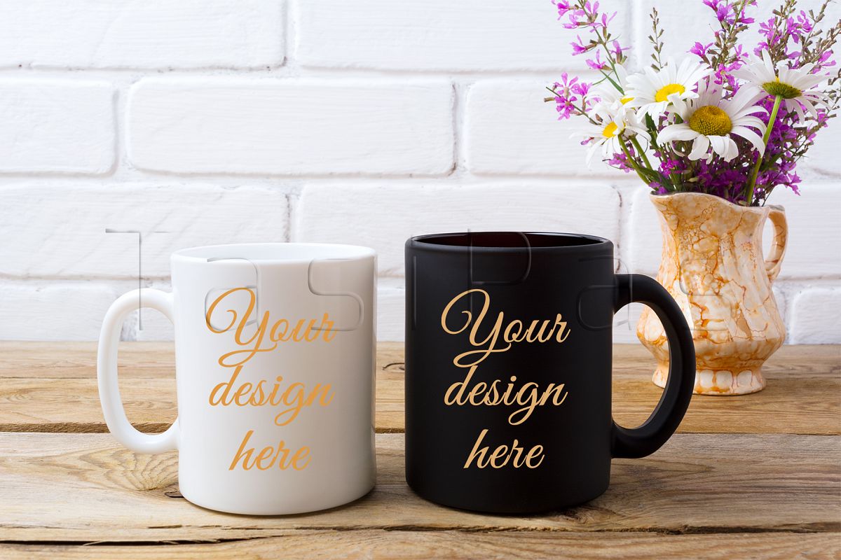 White and black coffee mug mockup with white chamomile and purple field flowers in golden pitcher vase. example image 1