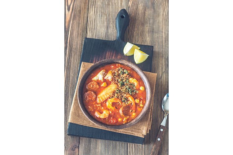 Portion of spanish fish and chorizo soup example image 1