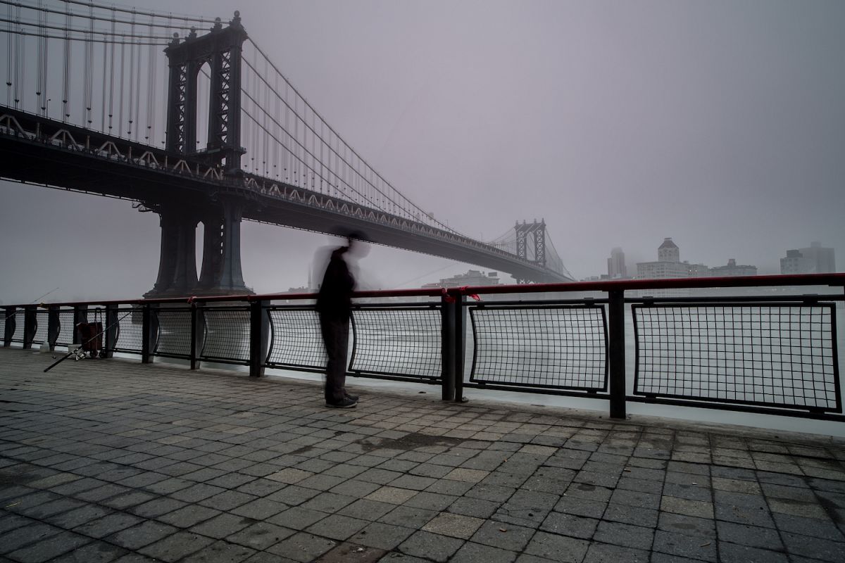 Man fishing in hudson river on a foggy morning example image 1