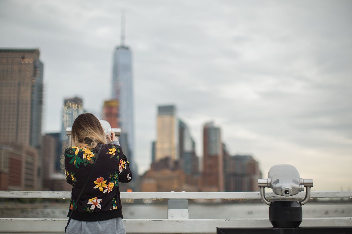 Girl looking thru telescope example image 1