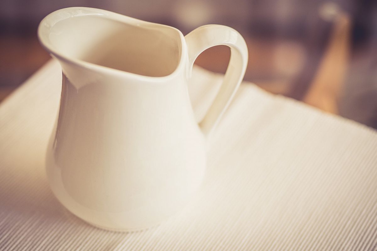 Milk Jug on a Glass Table - Warm Tone
