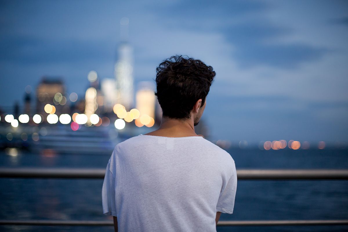 Man looking in to night city example image 1