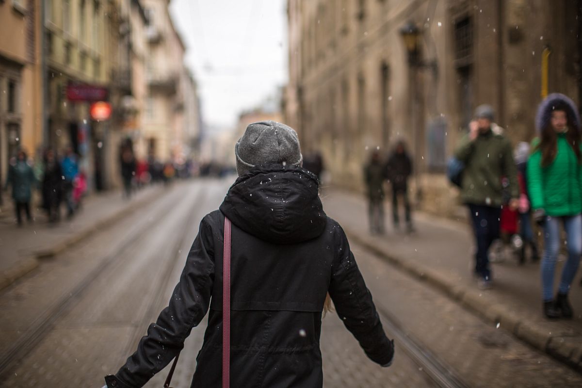 Women walking on the street at the snow fall example image 1