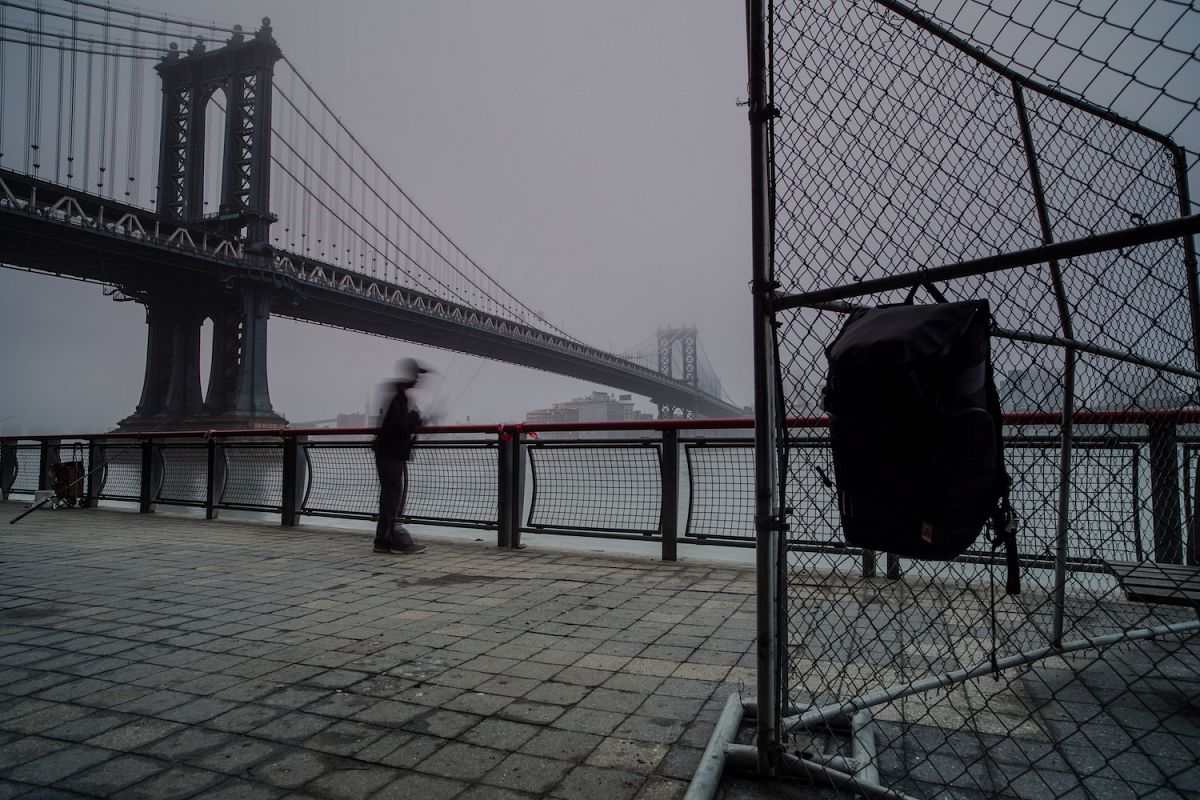 Man fishing in hudson river on a foggy morning example image 1