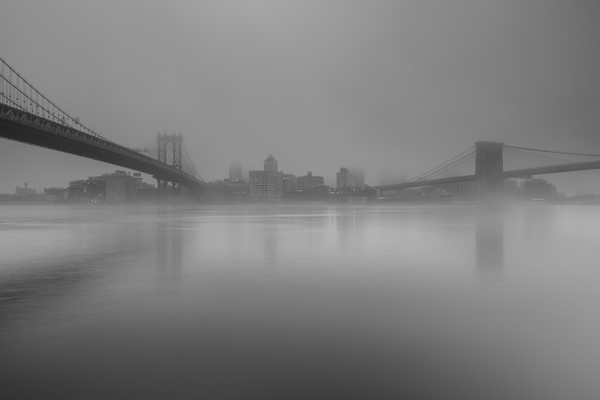 Dumbo view from east river on foggy morning example image 1