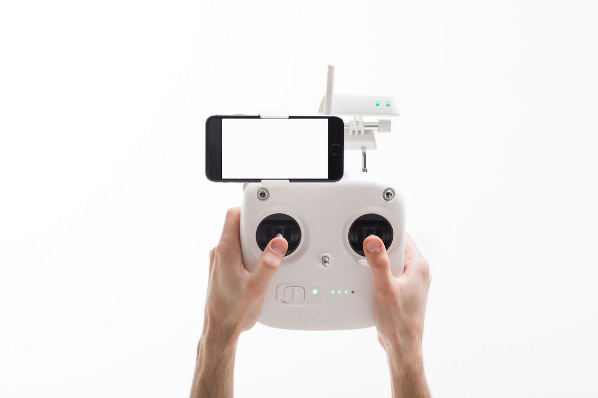 Smartphone with a blank screen on a drone controller example image 1
