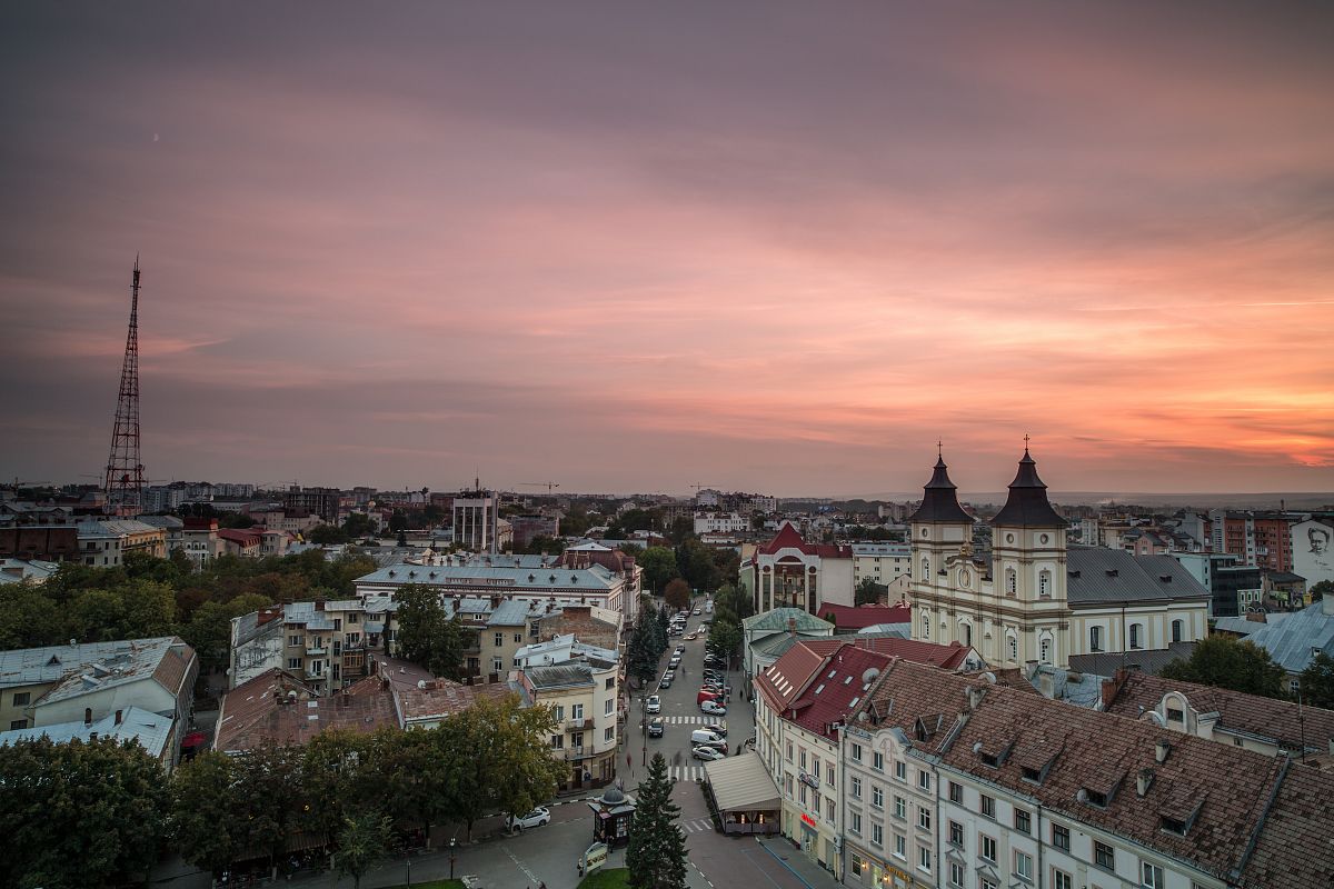 Aerial view of old European city during sunset example image 1
