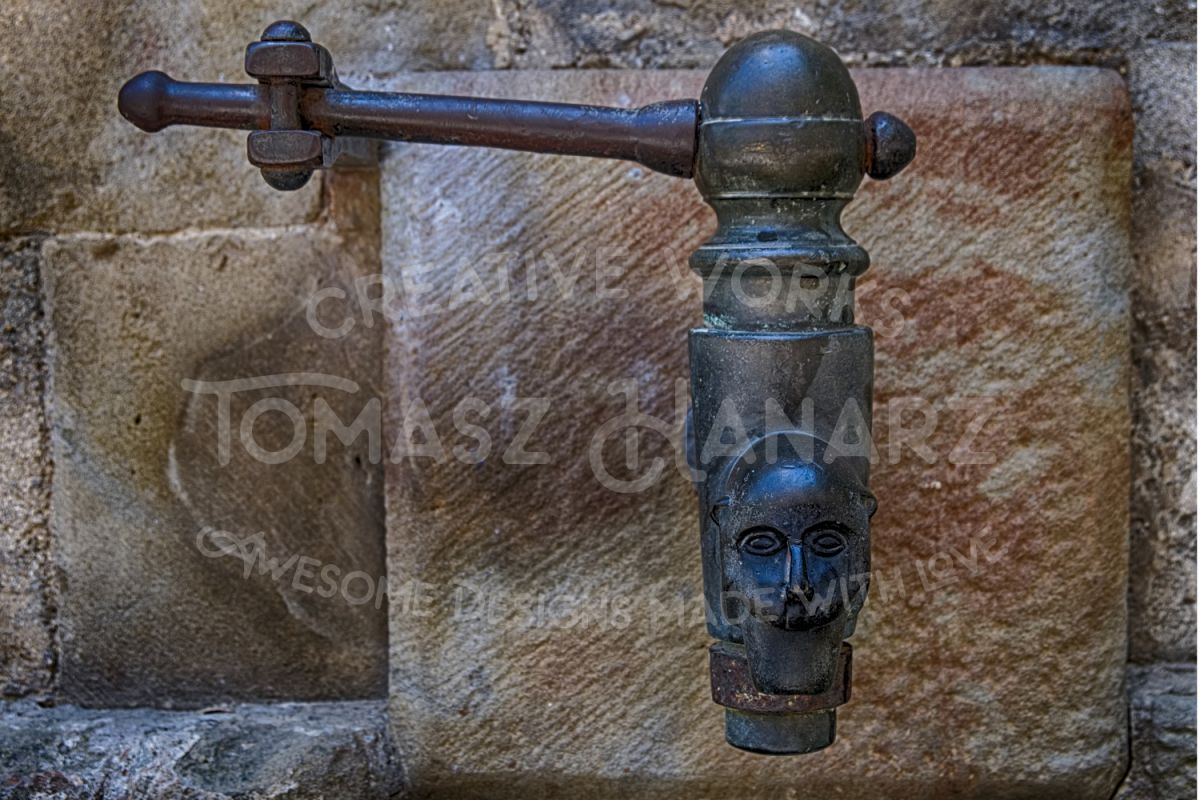 Ancient Iron Faucet On Stone Wall example image 1