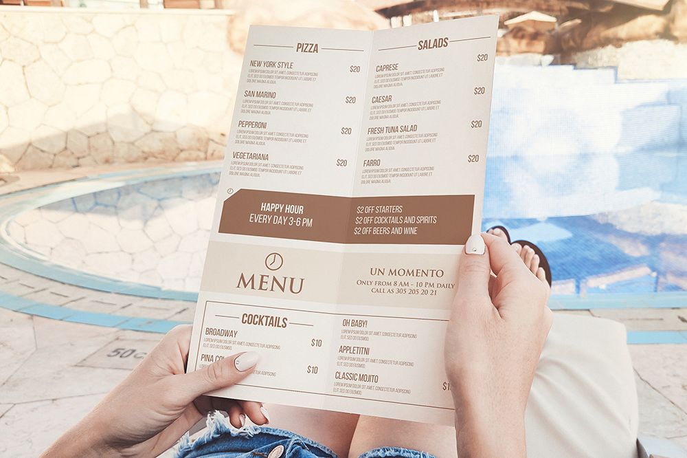 Bi-fold Menu In Hand Mockup example image 1