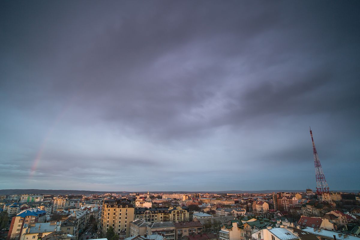 Sunset with rainbow view in a european city example image 1