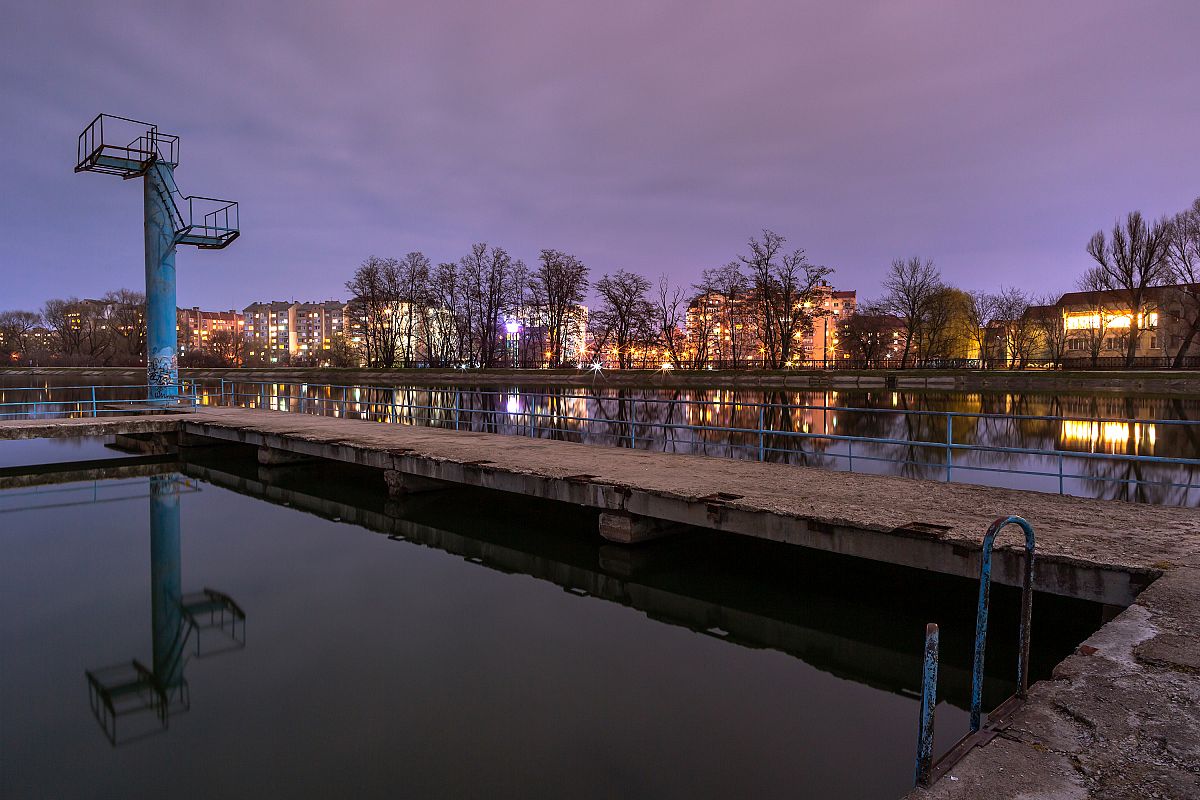 View on the lake with swimming area at night example image 1