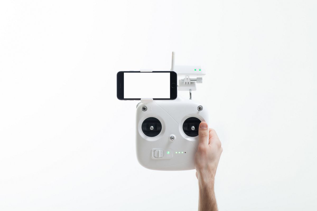 Smartphone with a blank screen on a drone controller example image 1