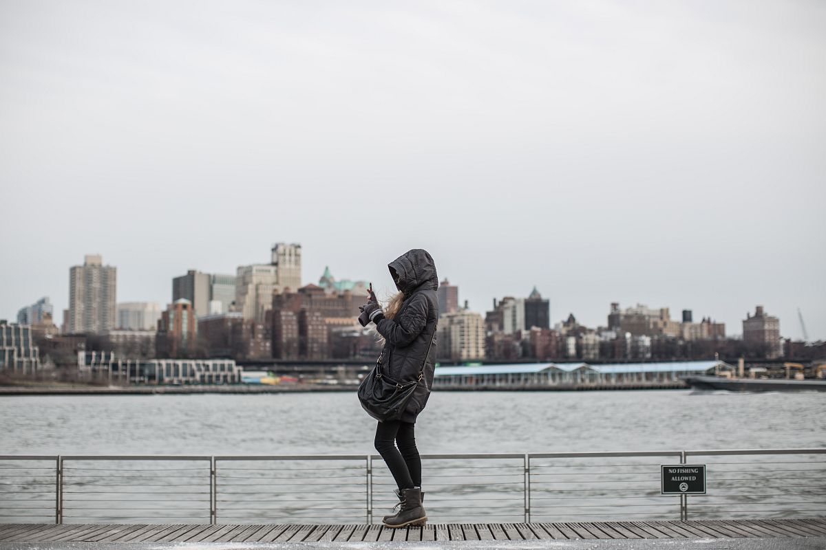 Girl taking pictures at the pier example image 1