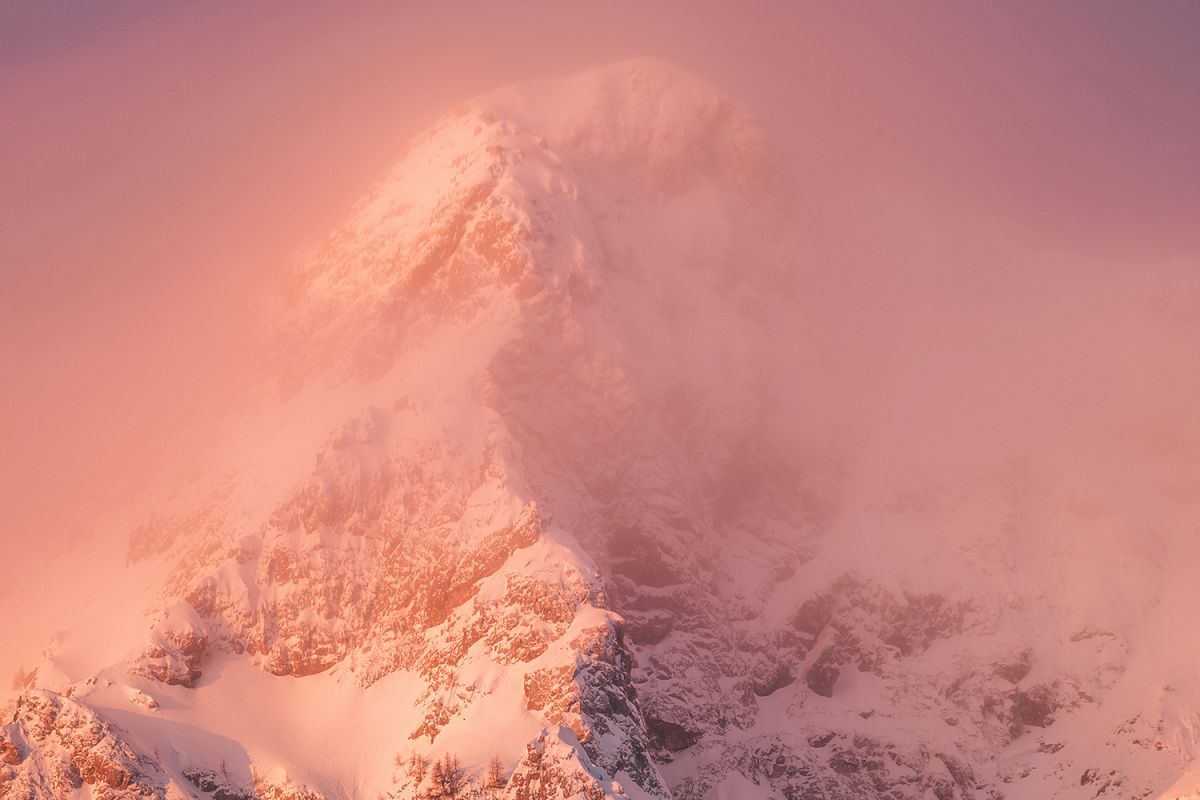 Mountains is pink light with fog example image 1
