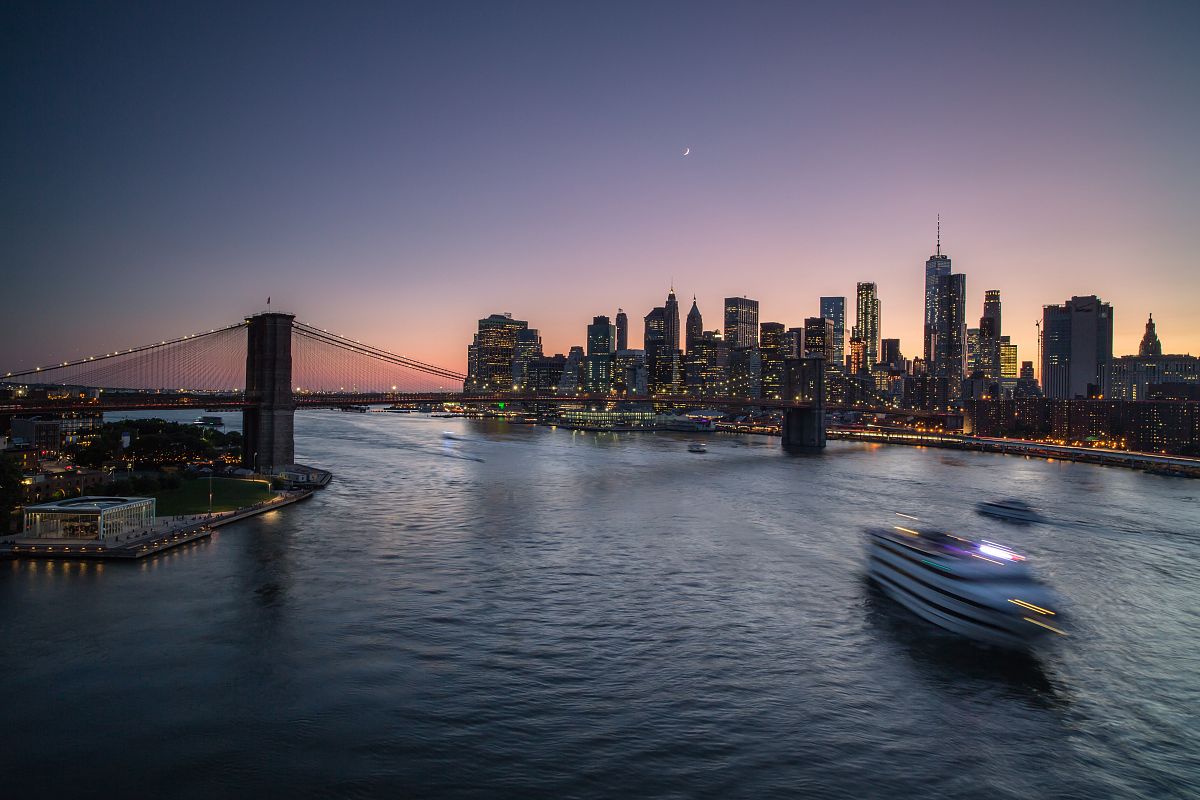 Cruiser crossing East River during sunset example image 1