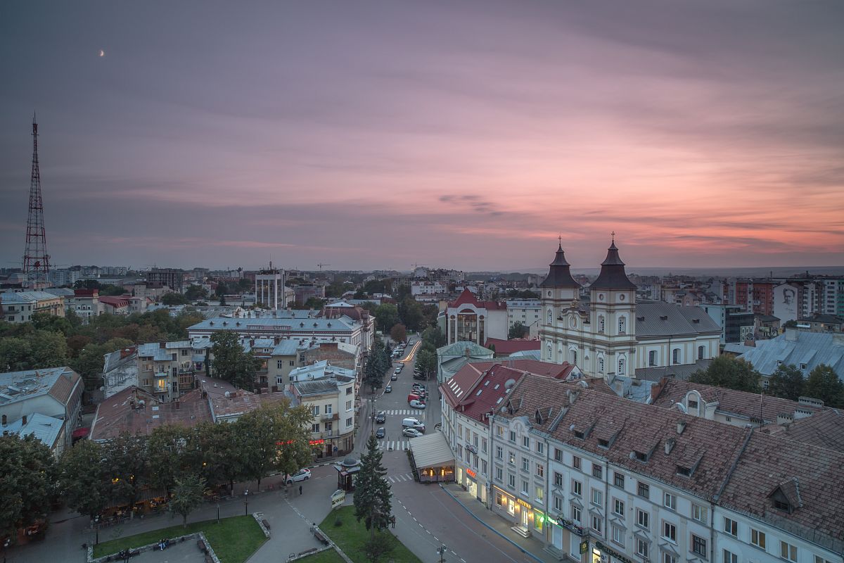 Aerial view of old European city during sunset example image 1