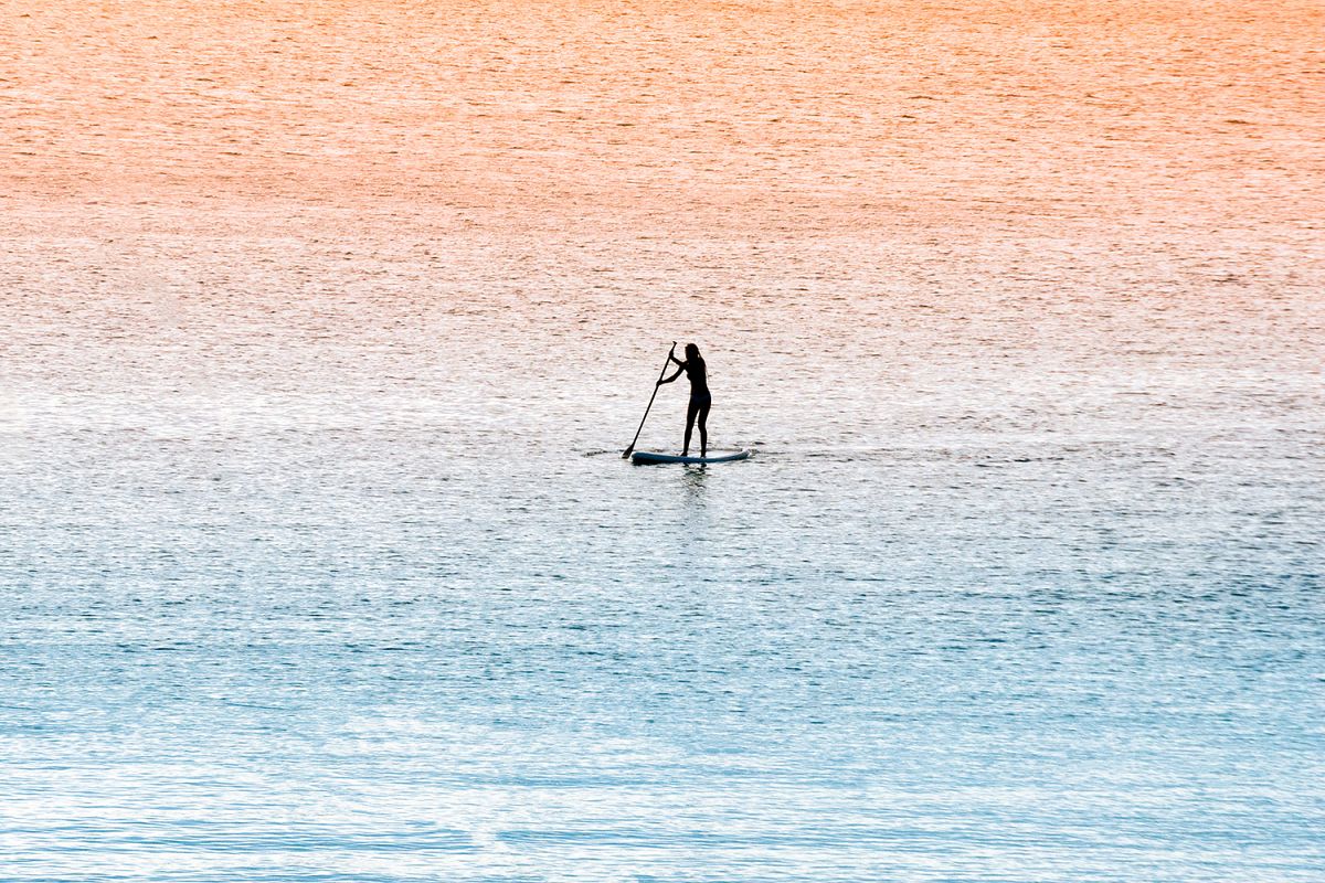 Standup paddle surfer girl example image 1