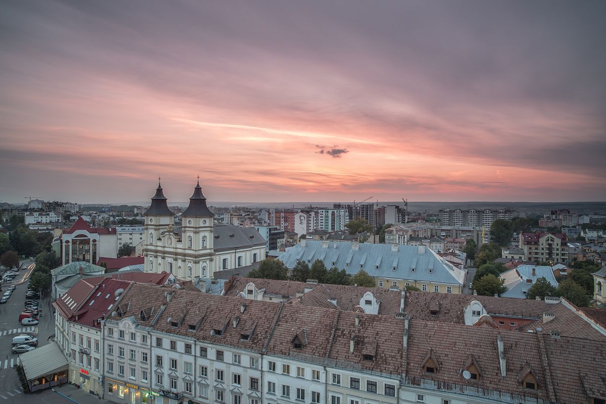 Aerial view of old European city during sunset example image 1
