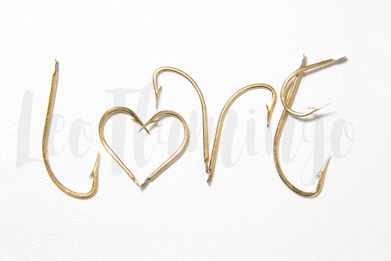 Valentine love concept golden fish hooks stock photo example image 1