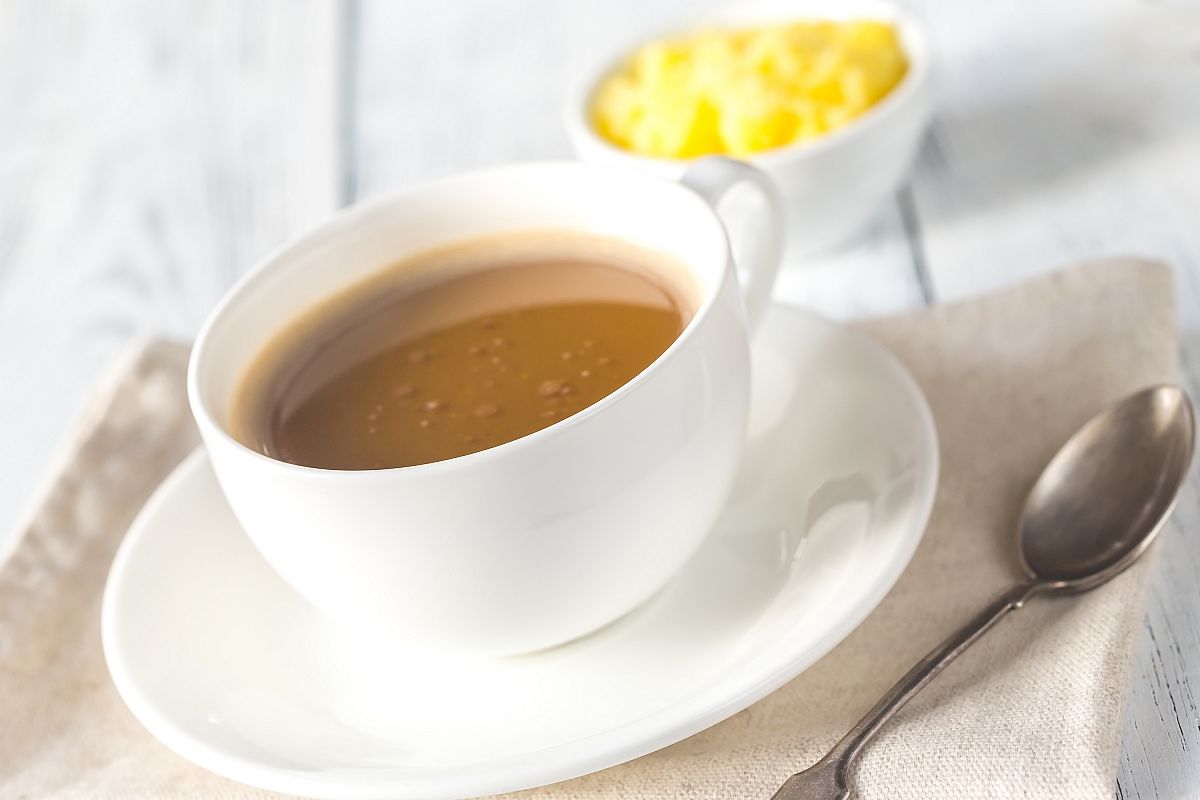 Cup of coffee with ghee butter example image 1