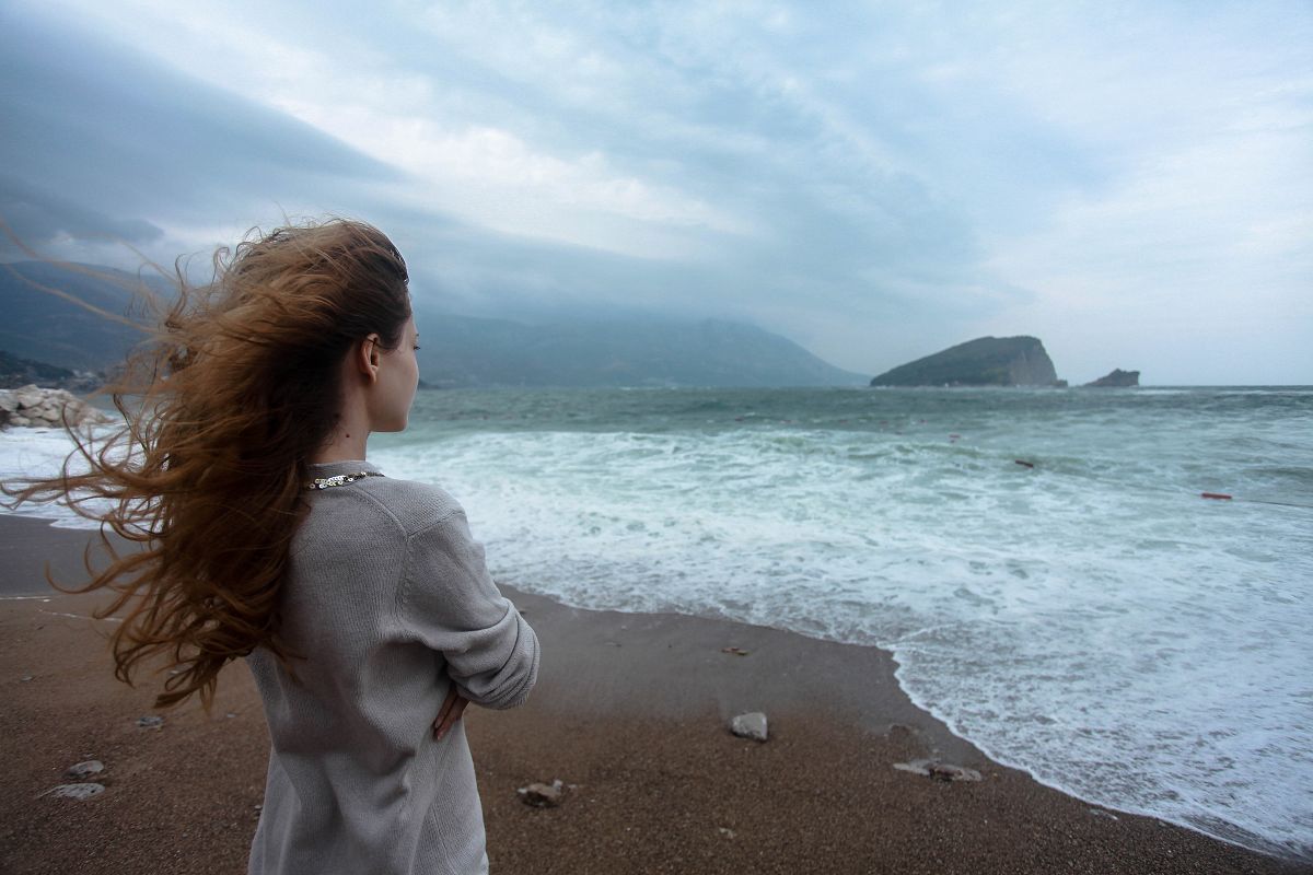 Woman looking into sea example image 1
