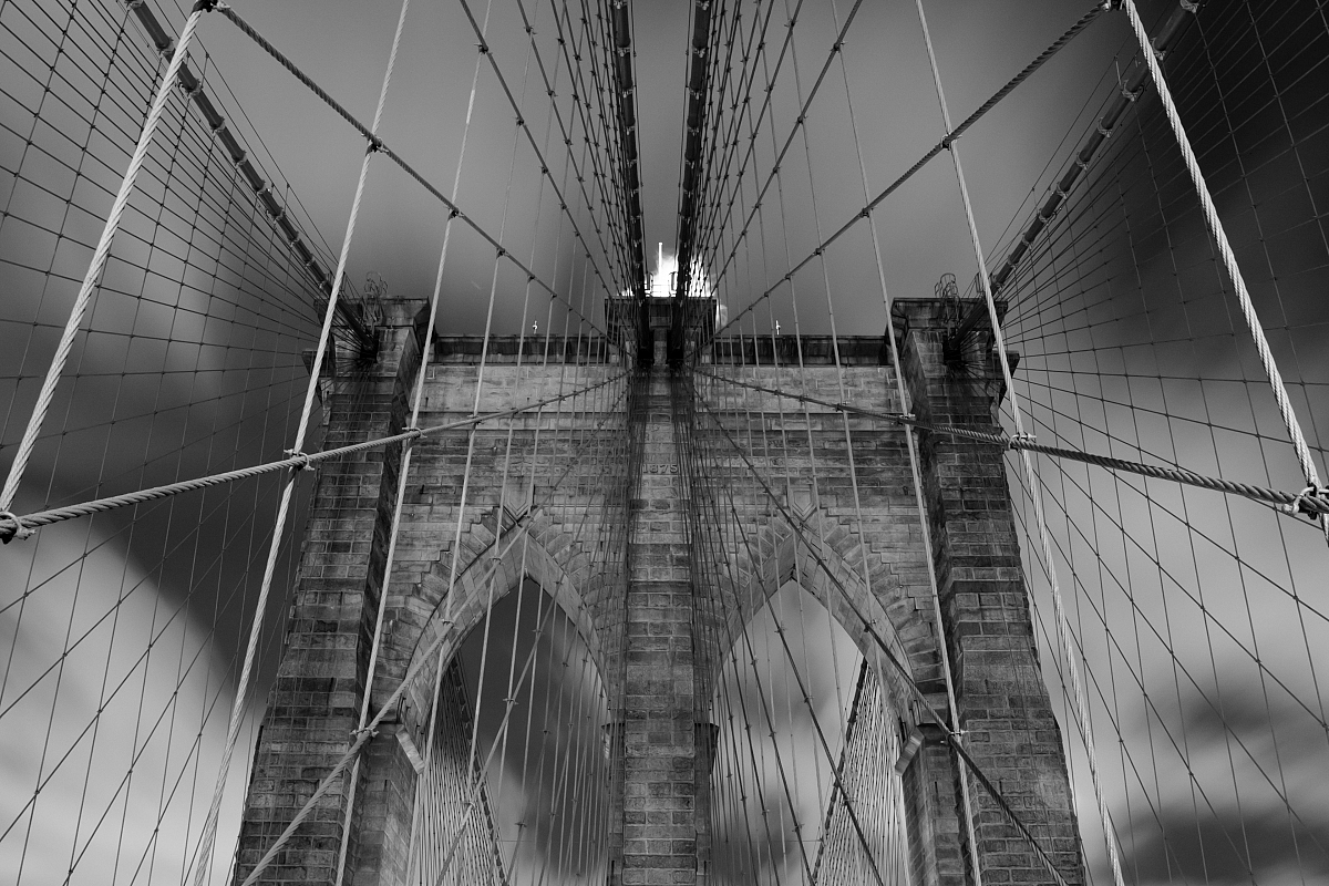 Brooklyn bridge during night, black and white photo example image 1