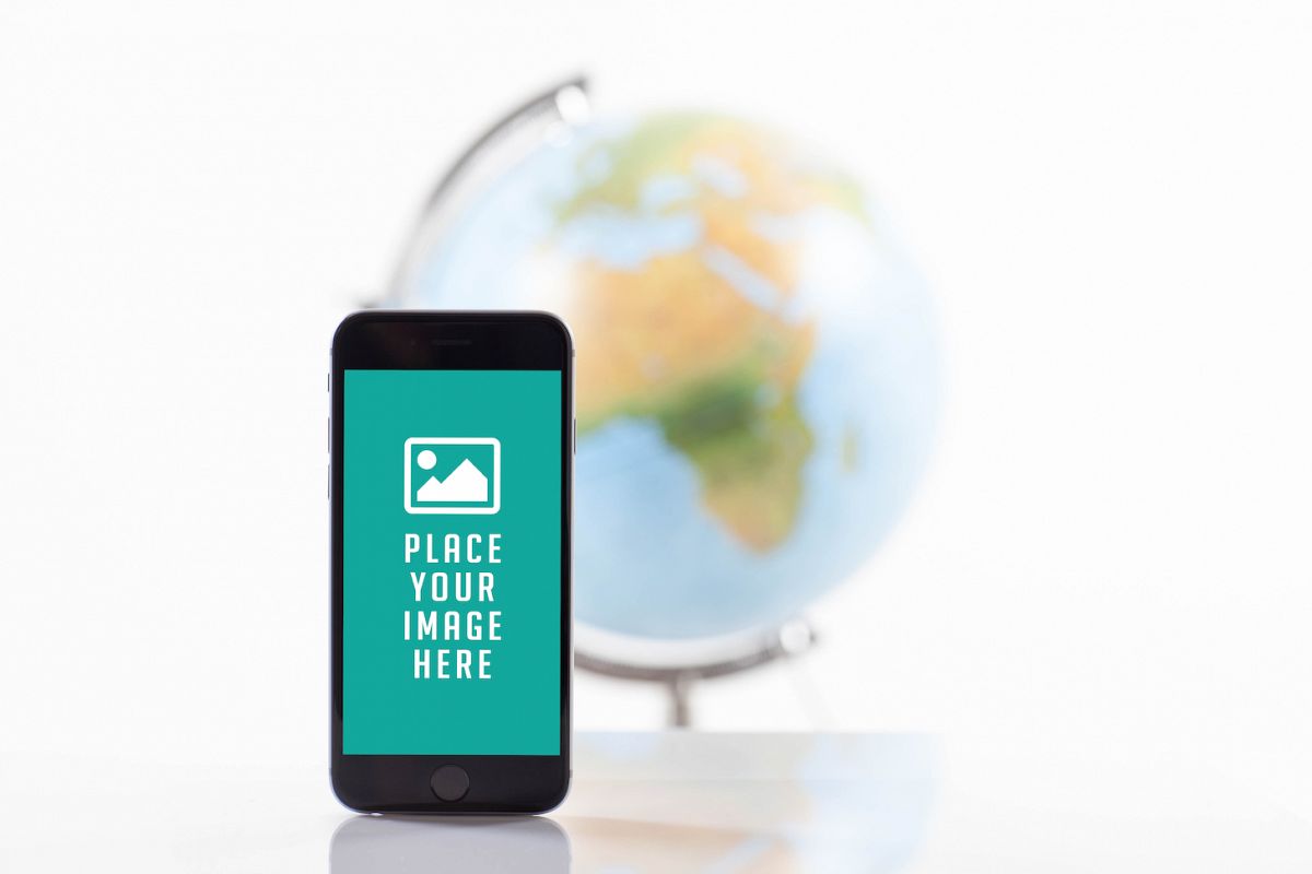 Mobile smart phone with blank screen , blur image of globe on back example image 1