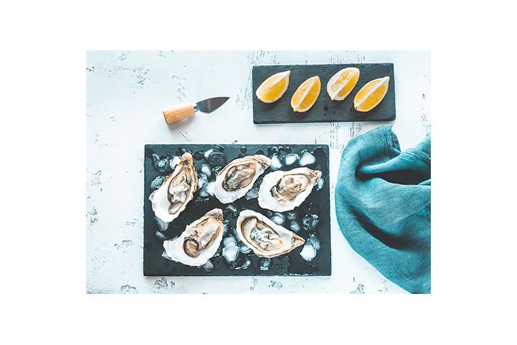 Raw oysters on the slate board example image 1