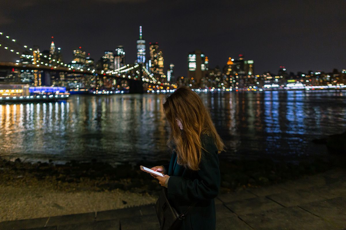 Women on the smartphone in New York at night example image 1