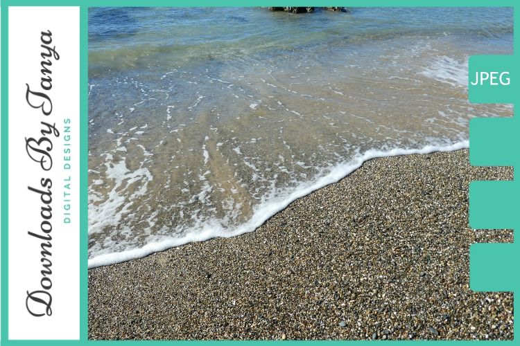Waves lapping a pebble beach photo example image 1