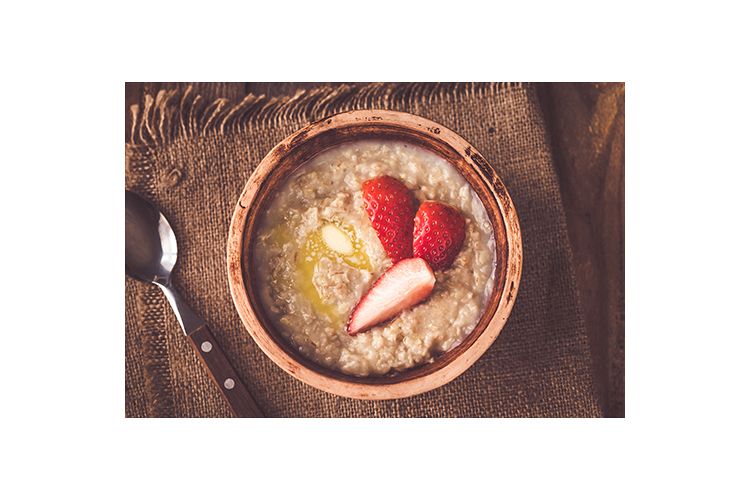 Bowl of oats with fresh strawberries example image 1