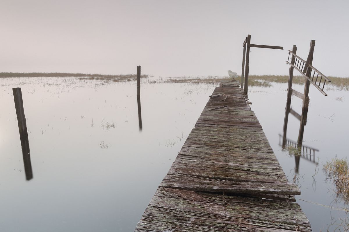 View on abandoned pier on a foggy morning example image 1