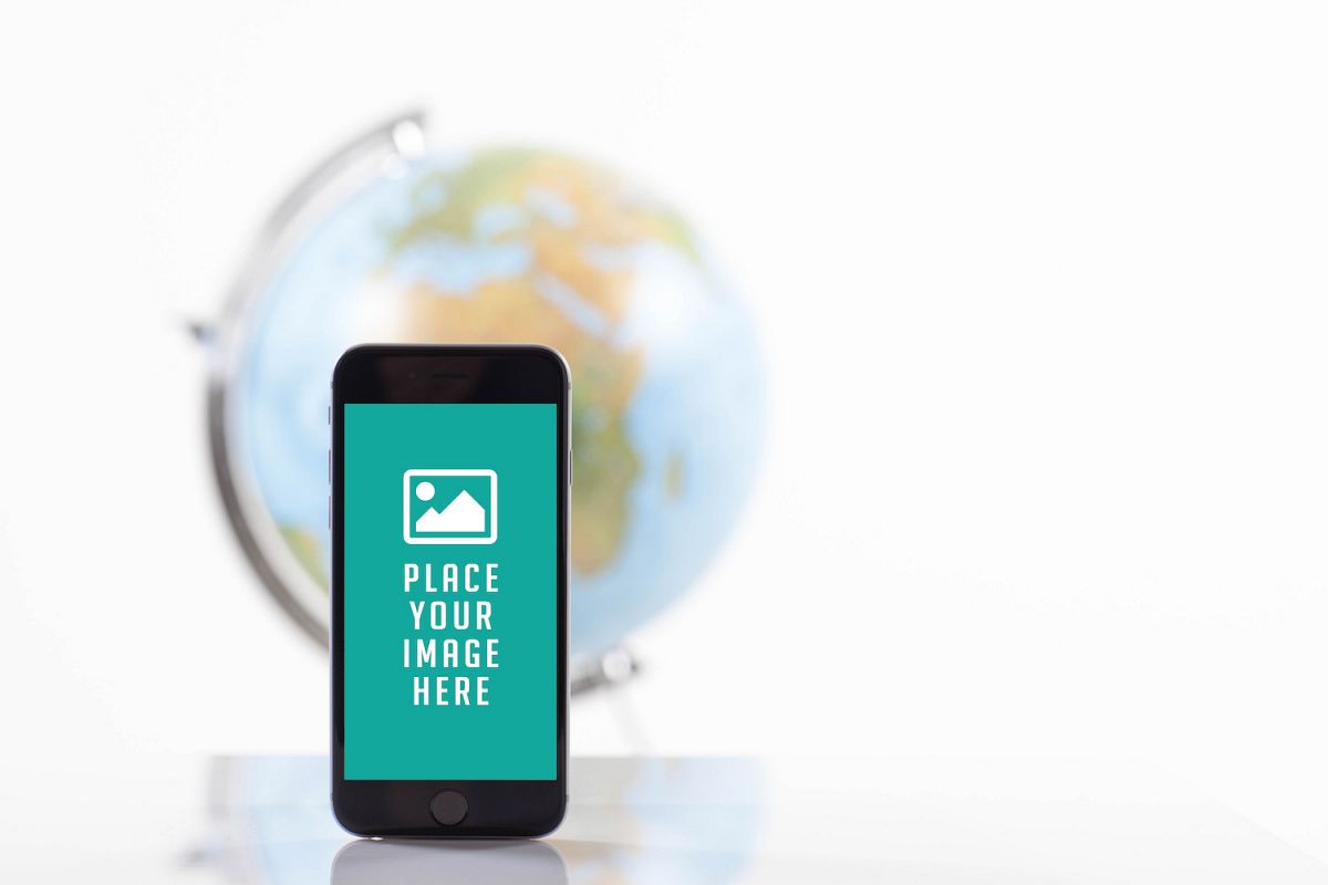 Mobile smart phone with blank screen , blur image of globe on back example image 1