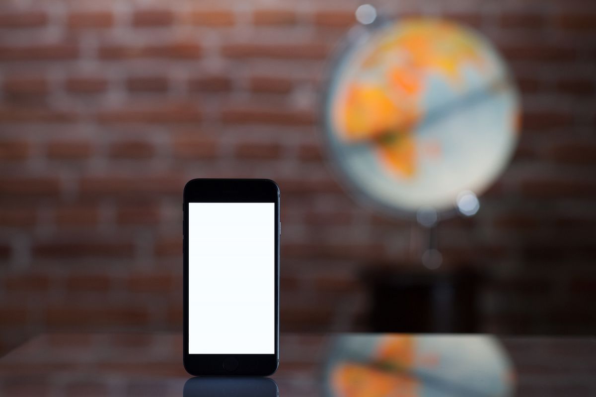 Mobile smart phone with blank screen,blur image on back example image 1