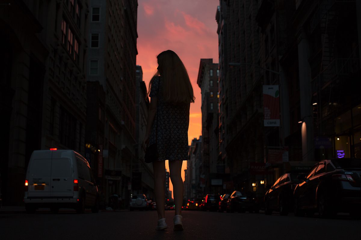 Women walking down the street during sunset example image 1